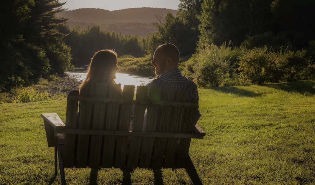 Two People Sitting On A Bench